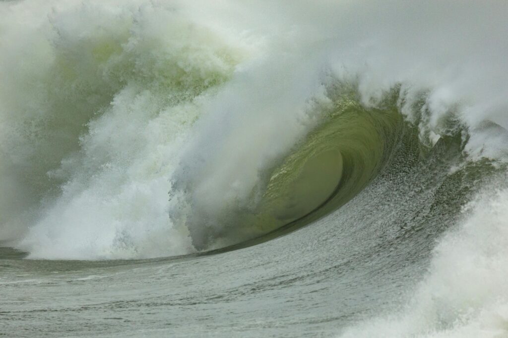 surfing the biggest wave. Large wave breaking