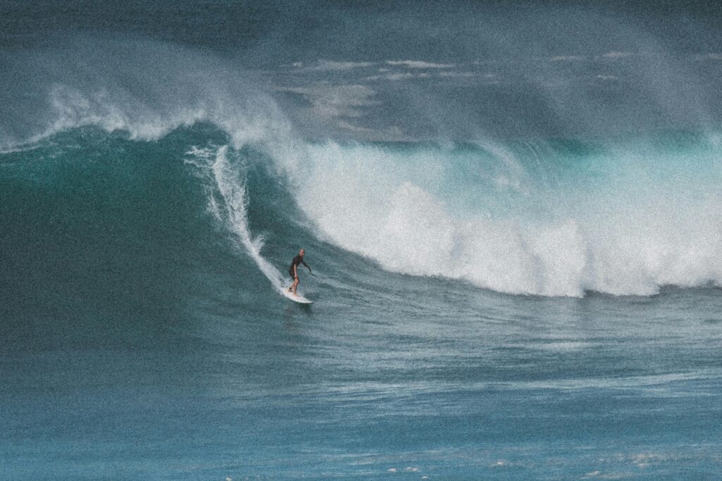 big wave riding. surfer rides a big unbroken wave
