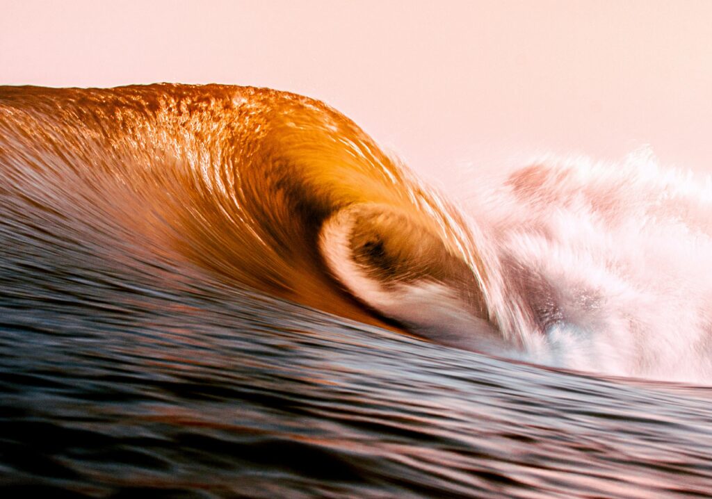 wave for surfing. wave breaking in a ocean glow.