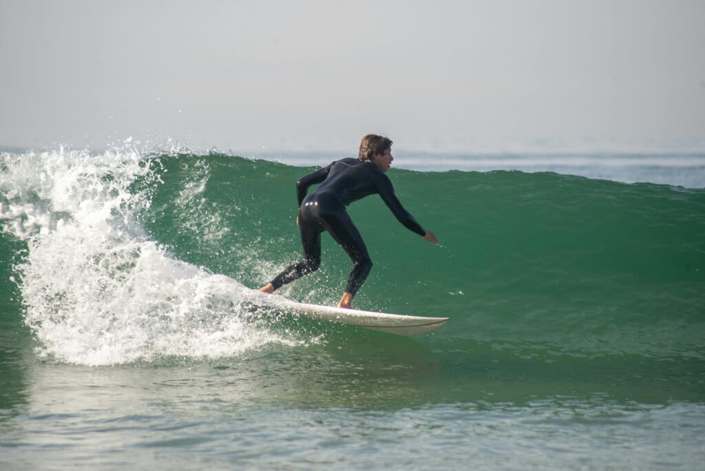 the wave. surfer riding green wave on shortboard