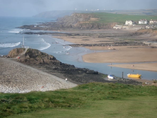 bude surfing lessons. Summerleaze beach breakwater looking towards crooklets beach.
